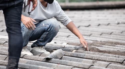 Inspecting of broken Tile Roof